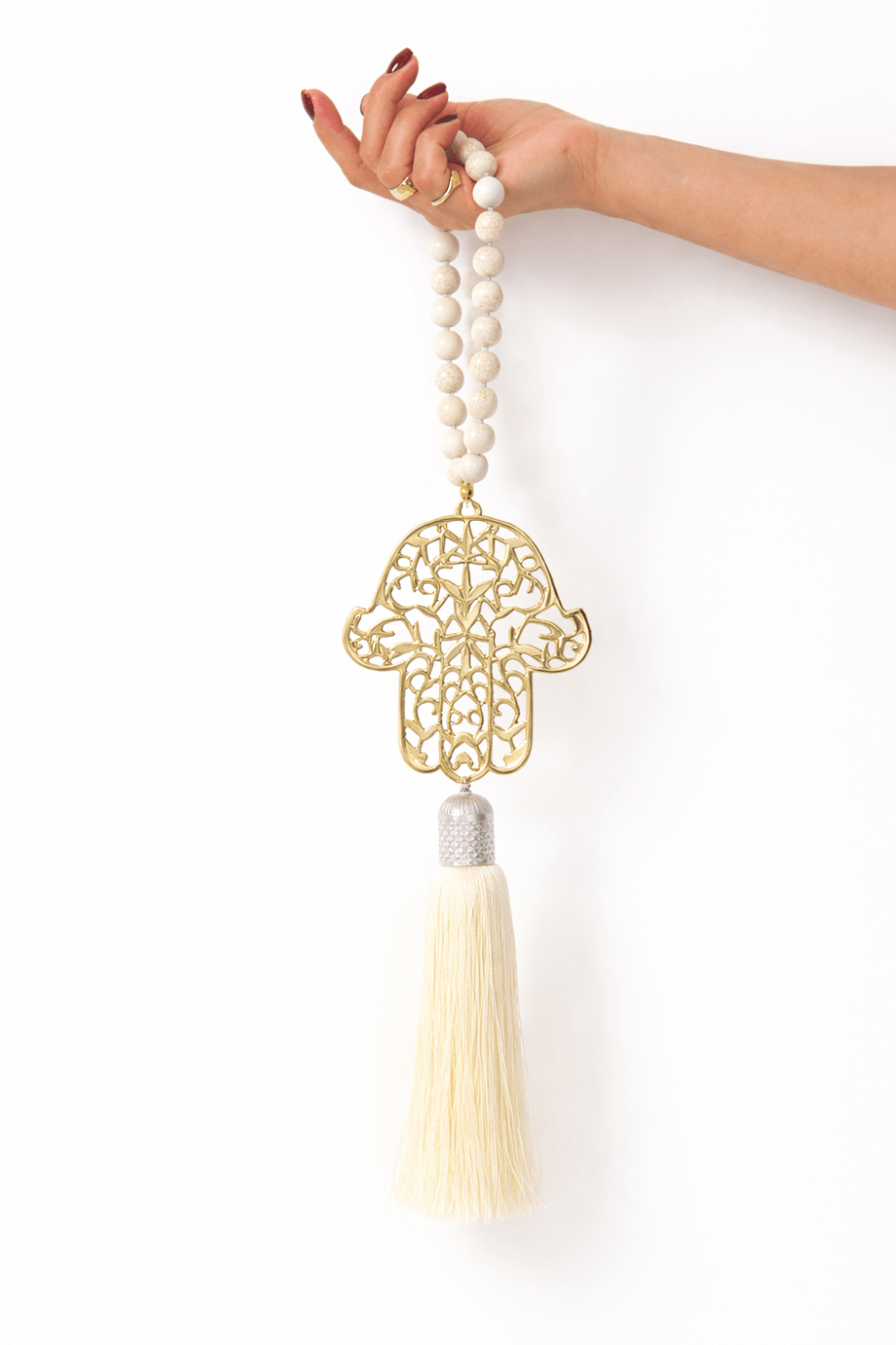 Gold Hamsa Wall Hanging with Howlite Stones - Protective Home Decor - Stylish Luck Home Decor | Hamsa \ Hand Of Fatima | Good Luck Gifts
hamsa-gold-howlite-cream-tassel.jpg
חמסה לקיר • חמסה זהב • חמסה זהב צהוב • חמסה עם היולייט • חמסה מעוצבת • חמסה לתלייה • אבני היולייט • סמלי מזל • שמירה לבית • מתנה לחנוכת בית • Stylish Luck • עיצוב הבית • מיוצר בישראל