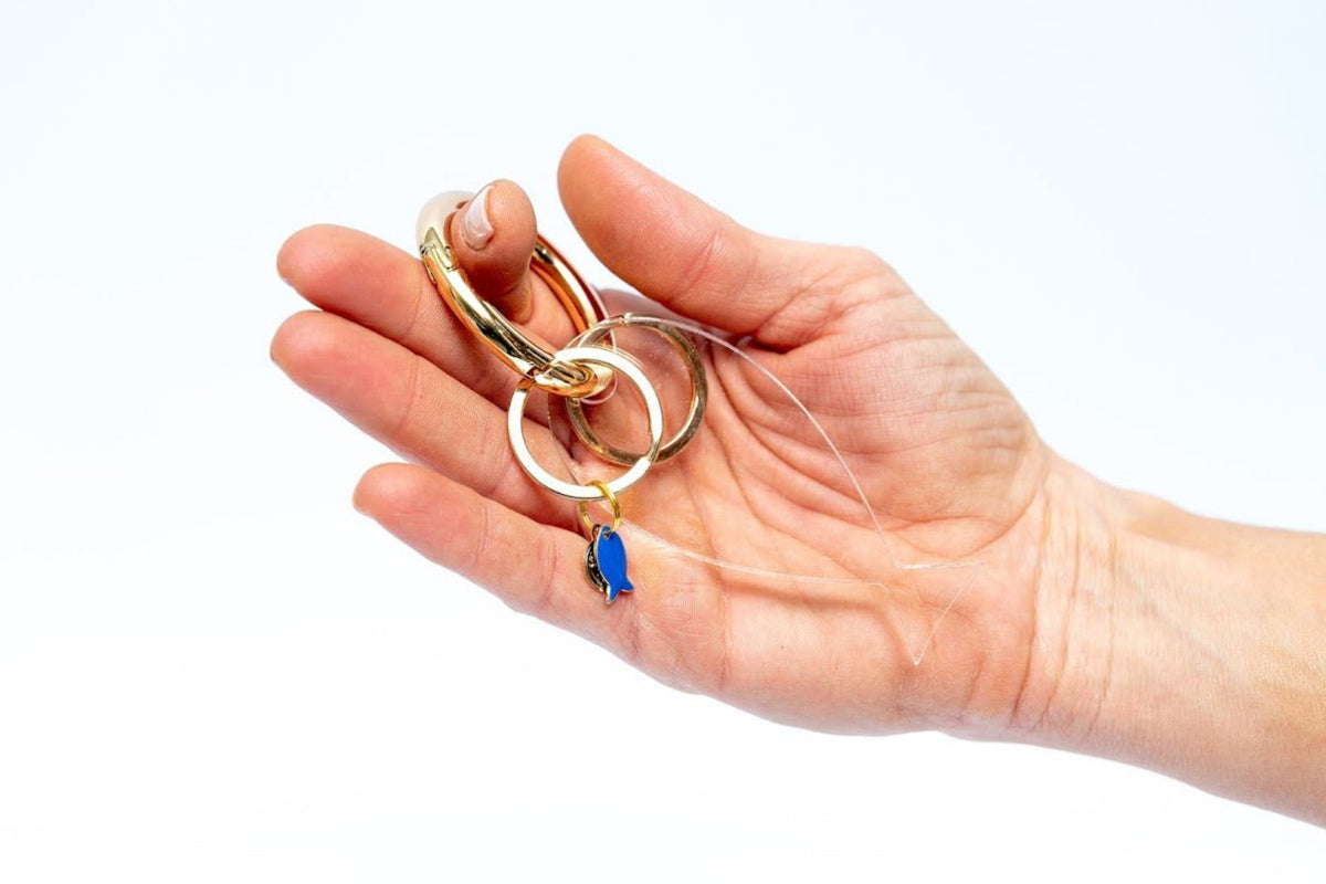 Fish lucky charm - key holder White acrylic Gold plated key holder - stylish luck home decor מחזיק מפתחות דג • מחזיק מפתחות מעוצב • דג לשמירה • סמלי מזל • שמירה מעין הרע • מתנה קטנה • מתנה לאישה • מתנה לחברה • Stylish Luck • מיוצר בישראל