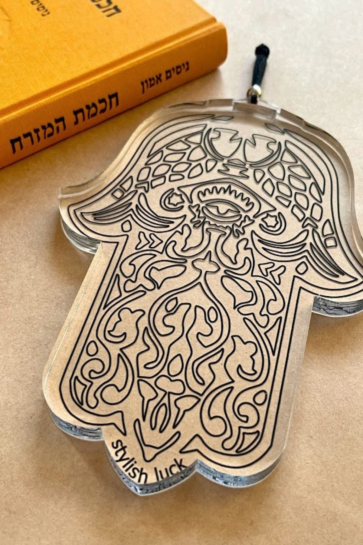 חמסה שקופה, חמסה מפרספקס, חמסה עם עין הרע, קישוט קיר חמסה, חמסה מעוצבת, קמע למזל טוב, חמסה מודרנית, חמסה לבית, חמסה ייחודית, חמסה להגנה, עיצוב רוחני לבית, חמסה אלגנטית, תכשיט קיר חמסה, חמסה חרוטה, קמעות ומזל.
Transparent Hamsa, acrylic Hamsa, engraved Hamsa, Evil Eye Hamsa, modern Hamsa decor, spiritual home decor, wall hanging Hamsa, lucky charm Hamsa, protection amulet, unique Hamsa design, acrylic wall decor, boho home accessory, positive energy charm, mystical home decor, elegant Hamsa ornament.stylish
