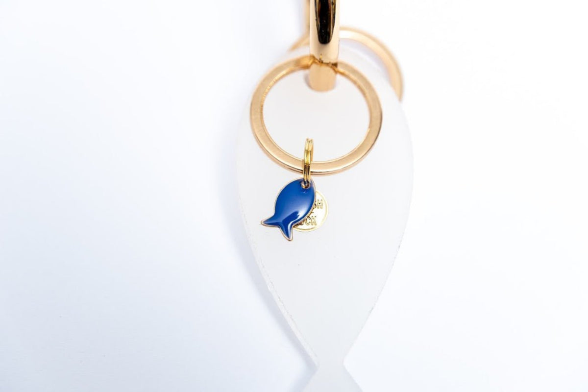 Fish lucky charm - key holder White acrylic Gold plated key holder - stylish luck home decor מחזיק מפתחות דג • מחזיק מפתחות מעוצב • דג לשמירה • סמלי מזל • שמירה מעין הרע • מתנה קטנה • מתנה לאישה • מתנה לחברה • Stylish Luck • מיוצר בישראל
